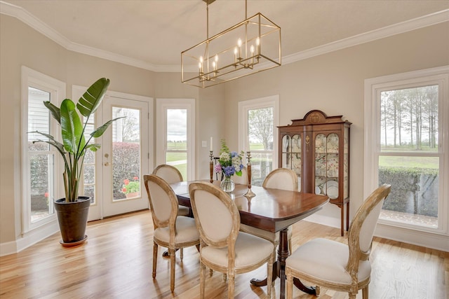 81 Two Mile Dr, Johnston, SC 29832 - dining room with ornamental molding, light wood-style flooring, and a chandelier