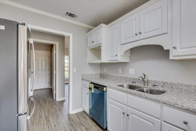 4620 Country Glen Cir, Grovetown, GA 30813 - kitchen with freestanding refrigerator, dishwasher, a sink, light wood-type flooring, and white cabinetry