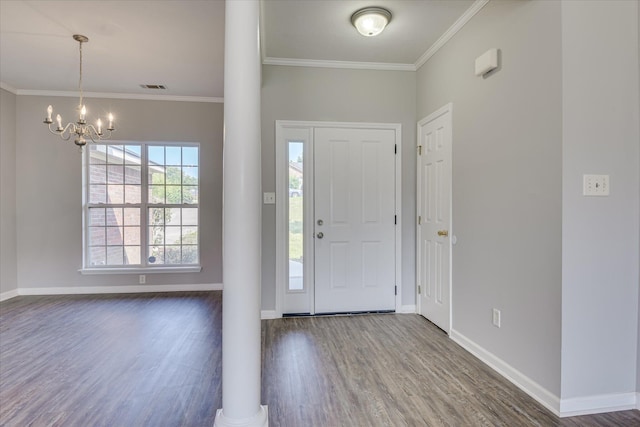 4620 Country Glen Cir, Grovetown, GA 30813 - foyer entrance featuring wood finished floors, a chandelier, ornamental molding, baseboards, and ornate columns