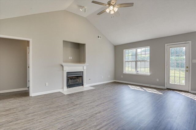 4620 Country Glen Cir, Grovetown, GA 30813 - unfurnished living room with a fireplace with flush hearth, a ceiling fan, wood finished floors, baseboards, and high vaulted ceiling