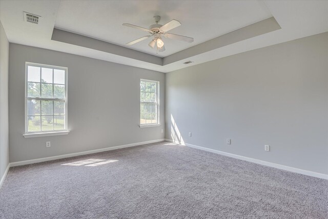 4620 Country Glen Cir, Grovetown, GA 30813 - carpeted empty room with a raised ceiling, baseboards, and ceiling fan