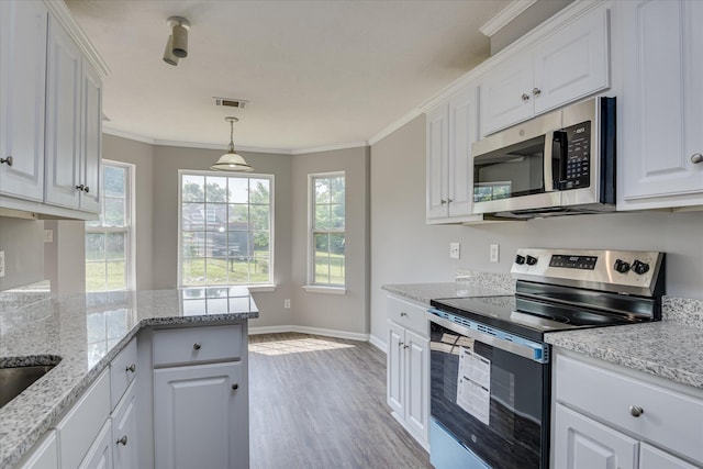 4620 Country Glen Cir, Grovetown, GA 30813 - kitchen with appliances with stainless steel finishes, white cabinetry, wood finished floors, ornamental molding, and baseboards