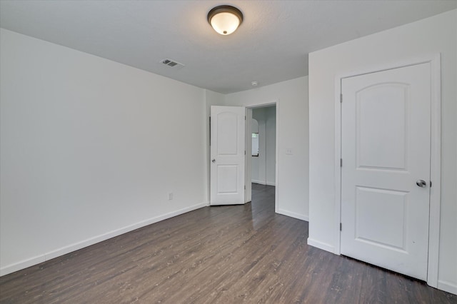 1586 Lee Beard Way, Augusta, GA 30901 - unfurnished bedroom featuring dark wood-style flooring and baseboards