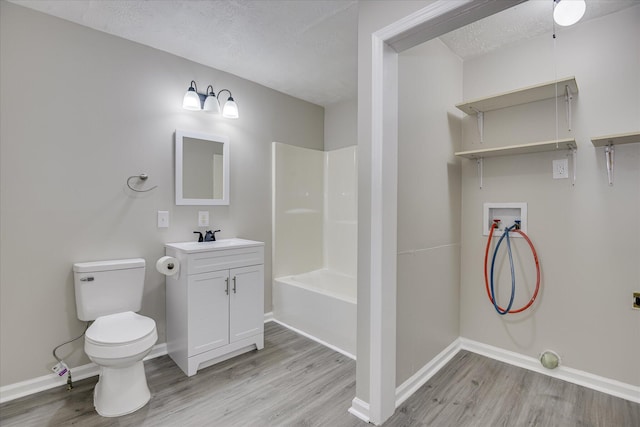 1608 Cider Ln, Augusta, GA 30906 - full bathroom with wood finished floors, vanity, baseboards, toilet, and a textured ceiling