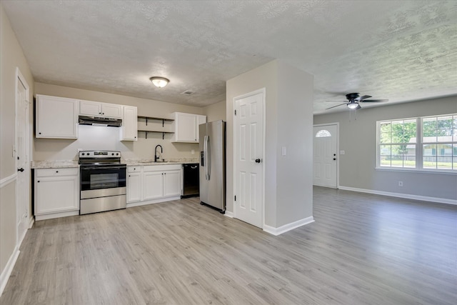 1608 Cider Ln, Augusta, GA 30906 - kitchen featuring appliances with stainless steel finishes, under cabinet range hood, a textured ceiling, a sink, and light wood finished floors