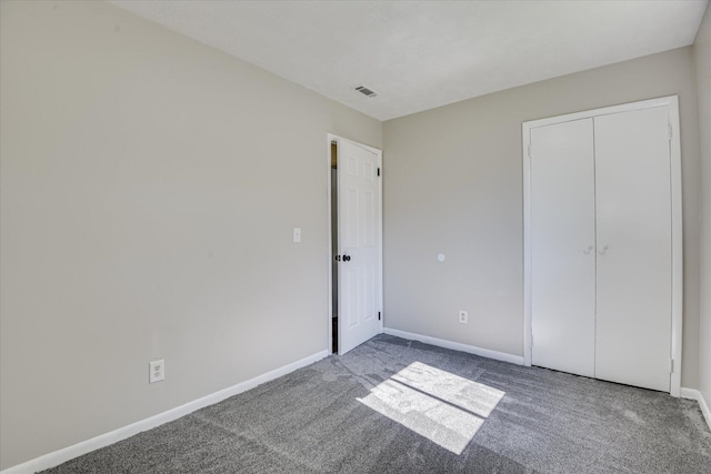 1608 Cider Ln, Augusta, GA 30906 - unfurnished bedroom featuring carpet, baseboards, and a closet
