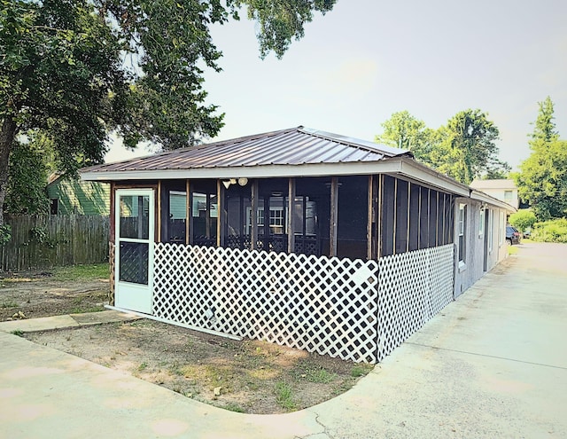 1431 Perry St, Augusta, GA 30901 - view of front of property featuring a sunroom and a metal roof
