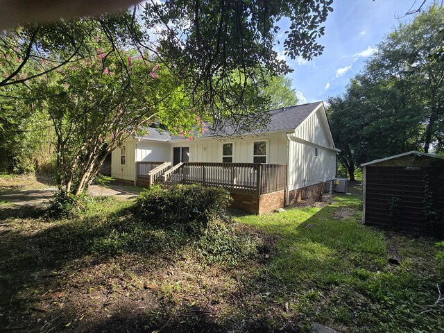 469 Lawrence Dr, Evans, GA 30809 - back of house with a deck, a storage shed, and roof with shingles