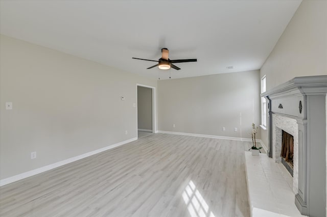 4171 Arlington Rd, Evans, GA 30809 - unfurnished living room featuring a ceiling fan, a fireplace, and light wood-type flooring