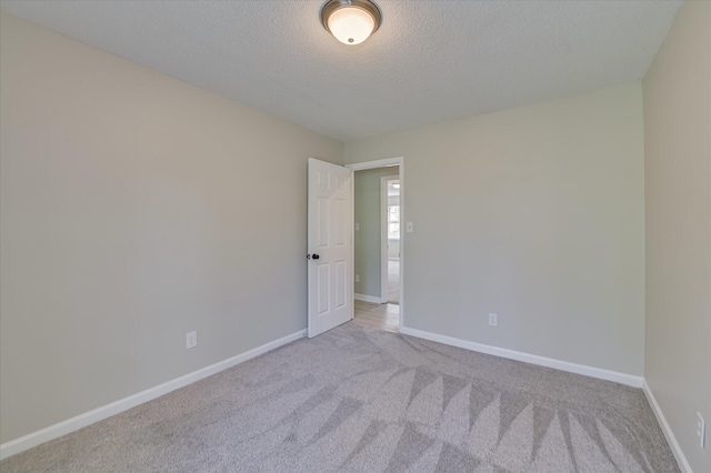4171 Arlington Rd, Evans, GA 30809 - carpeted empty room with a textured ceiling and baseboards
