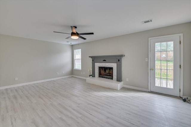 4171 Arlington Rd, Evans, GA 30809 - unfurnished living room featuring a ceiling fan, wood finished floors, and a fireplace with raised hearth