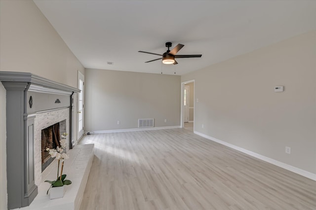 4171 Arlington Rd, Evans, GA 30809 - unfurnished living room with ceiling fan, light wood-style floors, and a brick fireplace
