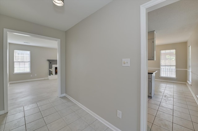 4171 Arlington Rd, Evans, GA 30809 - hallway featuring light tile patterned flooring and plenty of natural light