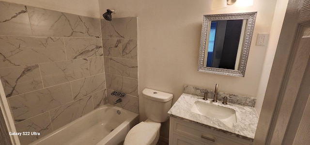 full bathroom with vanity, toilet, and tiled shower / bath