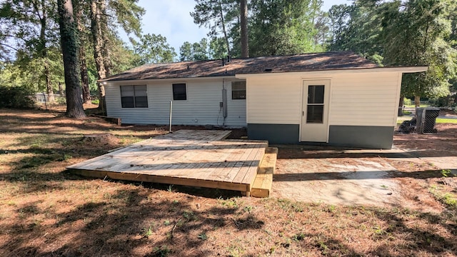 back of house featuring a deck