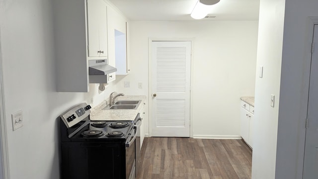 kitchen featuring wood-type flooring, white cabinetry, stainless steel range with electric stovetop, and sink