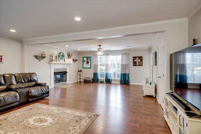 4478 Amanda Ct, Evans, GA 30809 - living area with dark wood-type flooring, a fireplace, ceiling fan, ornamental molding, and recessed lighting