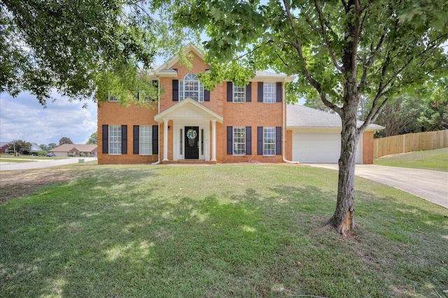 4478 Amanda Ct, Evans, GA 30809 - colonial home with concrete driveway, a garage, and brick siding