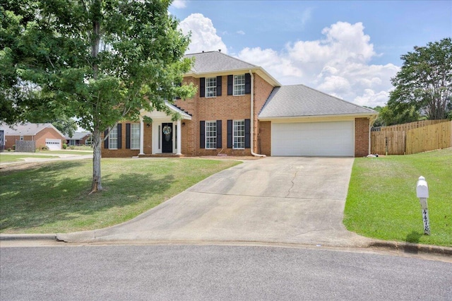 4478 Amanda Ct, Evans, GA 30809 - colonial house featuring driveway, an attached garage, and brick siding