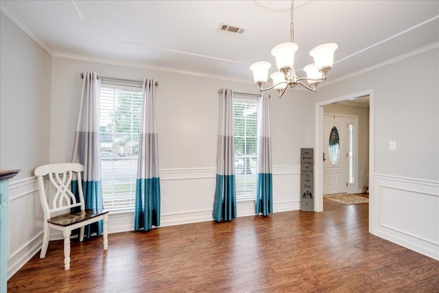 4478 Amanda Ct, Evans, GA 30809 - empty room featuring a chandelier, ornamental molding, healthy amount of natural light, wood finished floors, and a decorative wall