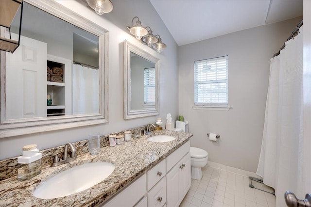 4478 Amanda Ct, Evans, GA 30809 - full bath featuring double vanity, tile patterned floors, and vaulted ceiling