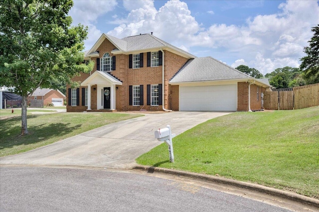 4478 Amanda Ct, Evans, GA 30809 - colonial-style house featuring driveway, a garage, and brick siding