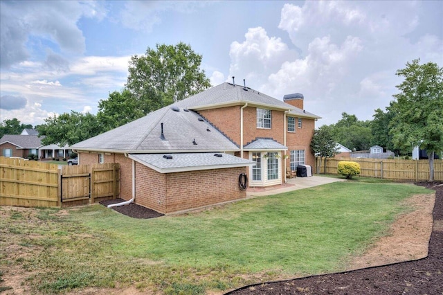 4478 Amanda Ct, Evans, GA 30809 - rear view of property with a chimney, a patio, brick siding, and a fenced backyard