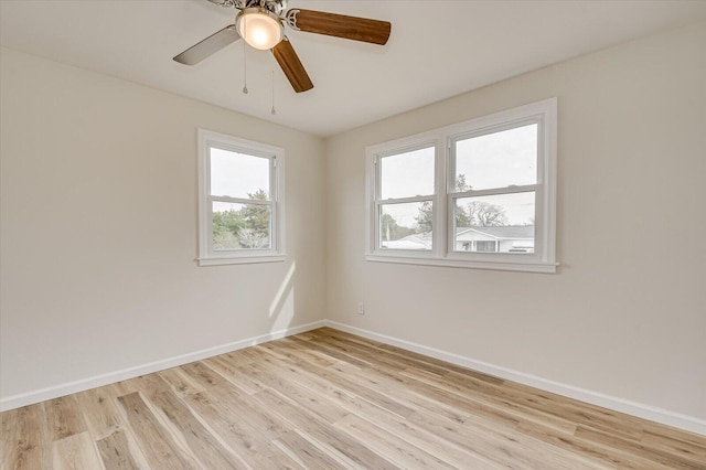 spare room with ceiling fan and light hardwood / wood-style flooring