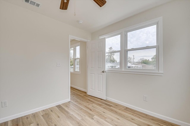 unfurnished room featuring ceiling fan and light hardwood / wood-style flooring