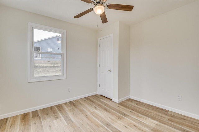 spare room featuring ceiling fan and light hardwood / wood-style flooring