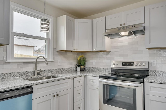 kitchen with sink, white cabinetry, stainless steel appliances, light stone counters, and decorative light fixtures