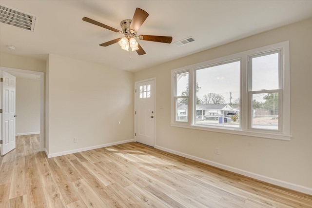 foyer entrance featuring ceiling fan and light hardwood / wood-style flooring