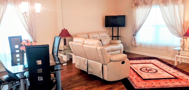 living room with dark hardwood / wood-style flooring