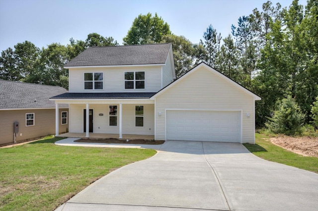 3605 Pebble Creek Dr, Hephzibah, GA 30815 - view of front facade featuring driveway, covered porch, an attached garage, and a front lawn