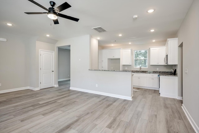 3605 Pebble Creek Dr, Hephzibah, GA 30815 - kitchen featuring light wood-style floors, a sink, white cabinetry, a ceiling fan, and baseboards