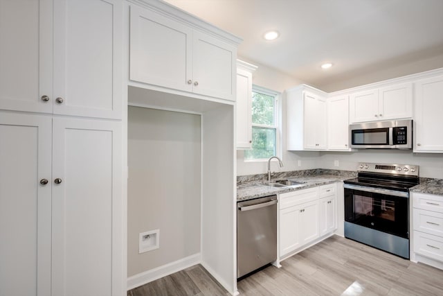 3605 Pebble Creek Dr, Hephzibah, GA 30815 - kitchen featuring stainless steel appliances, a sink, light wood finished floors, light stone counters, and recessed lighting