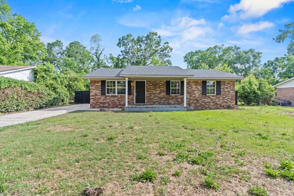 2707 Smith Dr, Augusta, GA 30906 - ranch-style house featuring a front lawn, a porch, and brick siding
