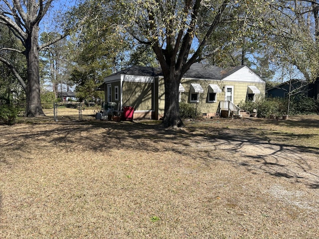 303 Spruce St, Louisville, GA 30434 - view of front of house with a gate, fence, and crawl space
