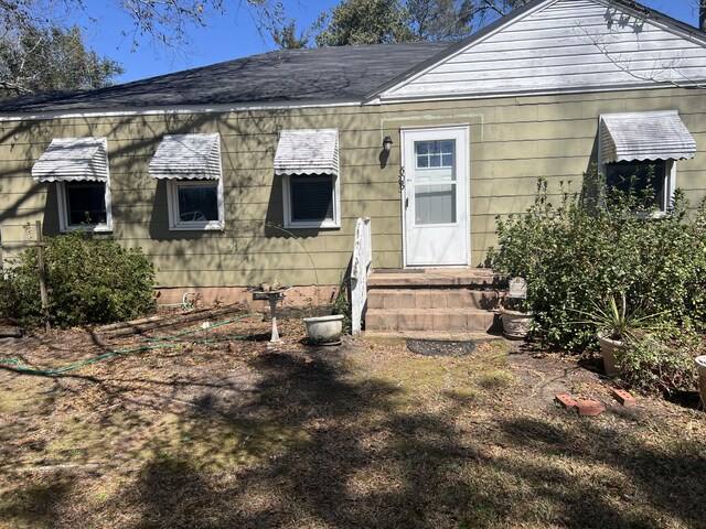 303 Spruce St, Louisville, GA 30434 - view of front of home with roof with shingles