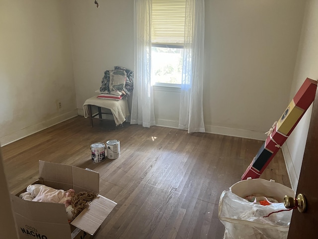 303 Spruce St, Louisville, GA 30434 - bedroom featuring baseboards and wood finished floors