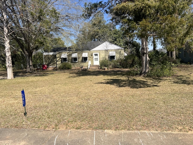 303 Spruce St, Louisville, GA 30434 - view of front of property with a front lawn