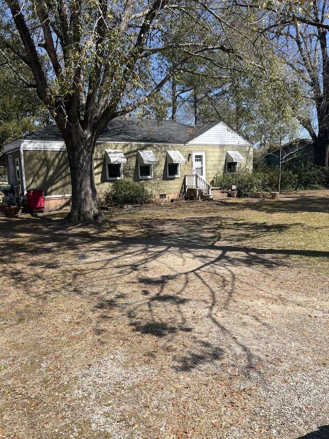 303 Spruce St, Louisville, GA 30434 - view of front of house with crawl space and a shingled roof