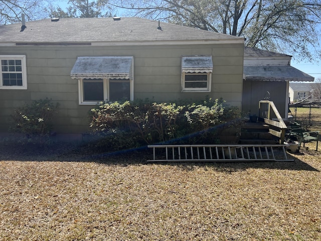 303 Spruce St, Louisville, GA 30434 - back of property featuring a shingled roof