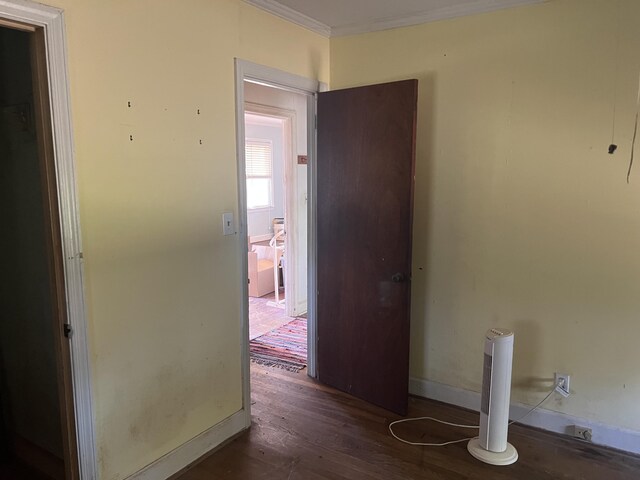 303 Spruce St, Louisville, GA 30434 - hall featuring crown molding, baseboards, and wood finished floors