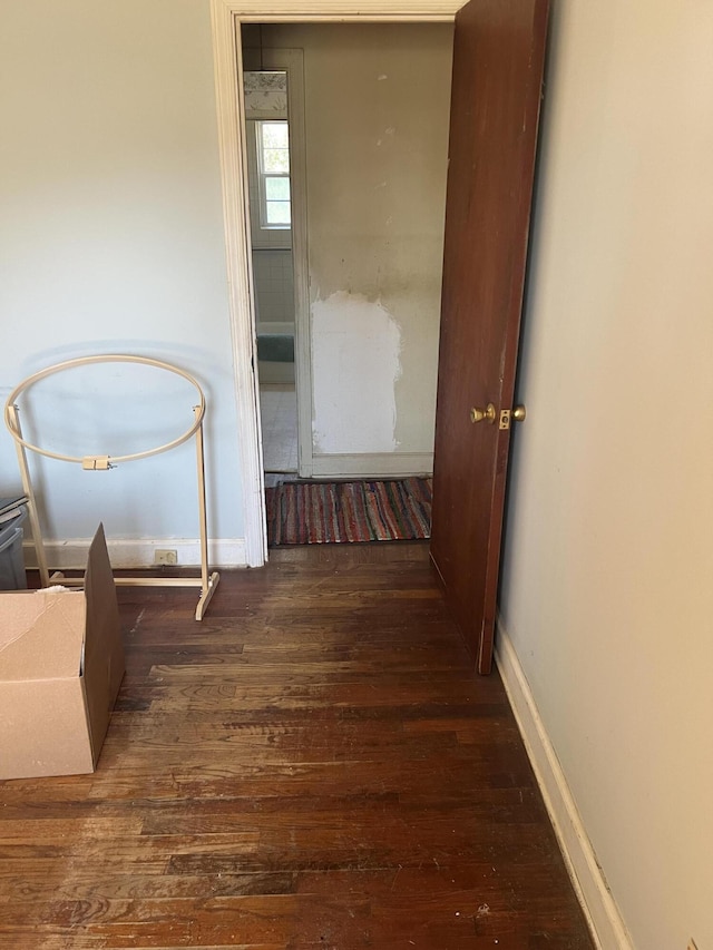 303 Spruce St, Louisville, GA 30434 - hallway with baseboards and wood finished floors