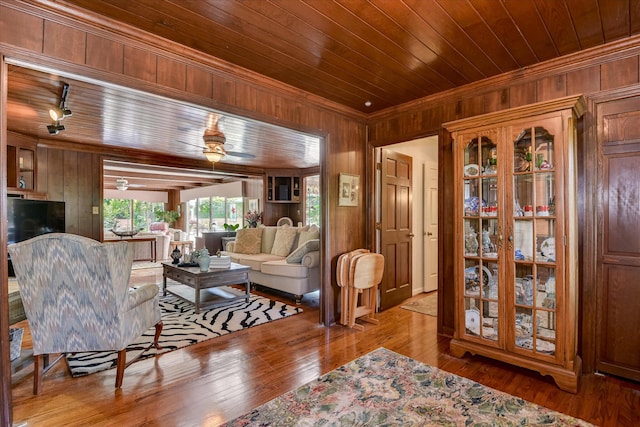 804 Camellia Rd, Augusta, GA 30909 - living area with crown molding, wood walls, wooden ceiling, hardwood / wood-style floors, and ceiling fan