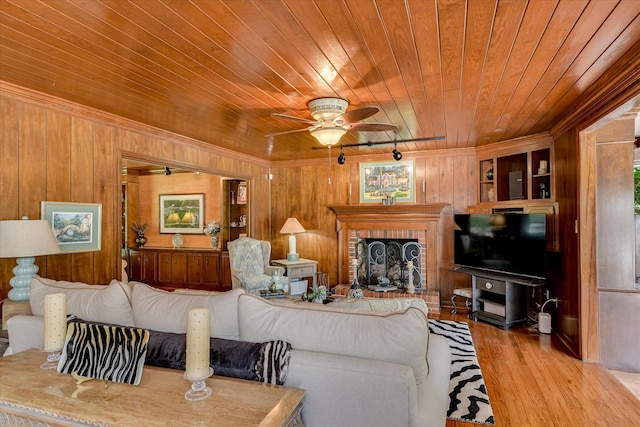 804 Camellia Rd, Augusta, GA 30909 - living area with wooden ceiling, wooden walls, ceiling fan, wood finished floors, and ornamental molding