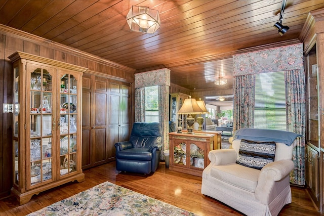 804 Camellia Rd, Augusta, GA 30909 - sitting room with crown molding, wooden walls, wooden ceiling, track lighting, and wood finished floors