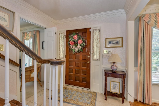 804 Camellia Rd, Augusta, GA 30909 - foyer entrance featuring ornamental molding, stairway, light tile patterned flooring, wallpapered walls, and healthy amount of natural light