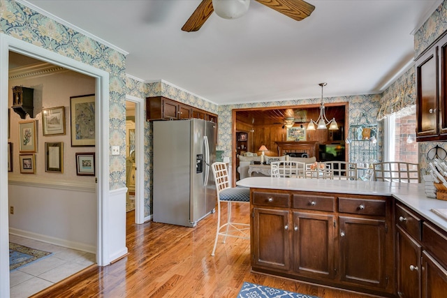 804 Camellia Rd, Augusta, GA 30909 - kitchen with stainless steel refrigerator with ice dispenser, wallpapered walls, ceiling fan, a peninsula, and light countertops